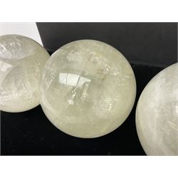 Set of three clear calcite spheres, D8cm