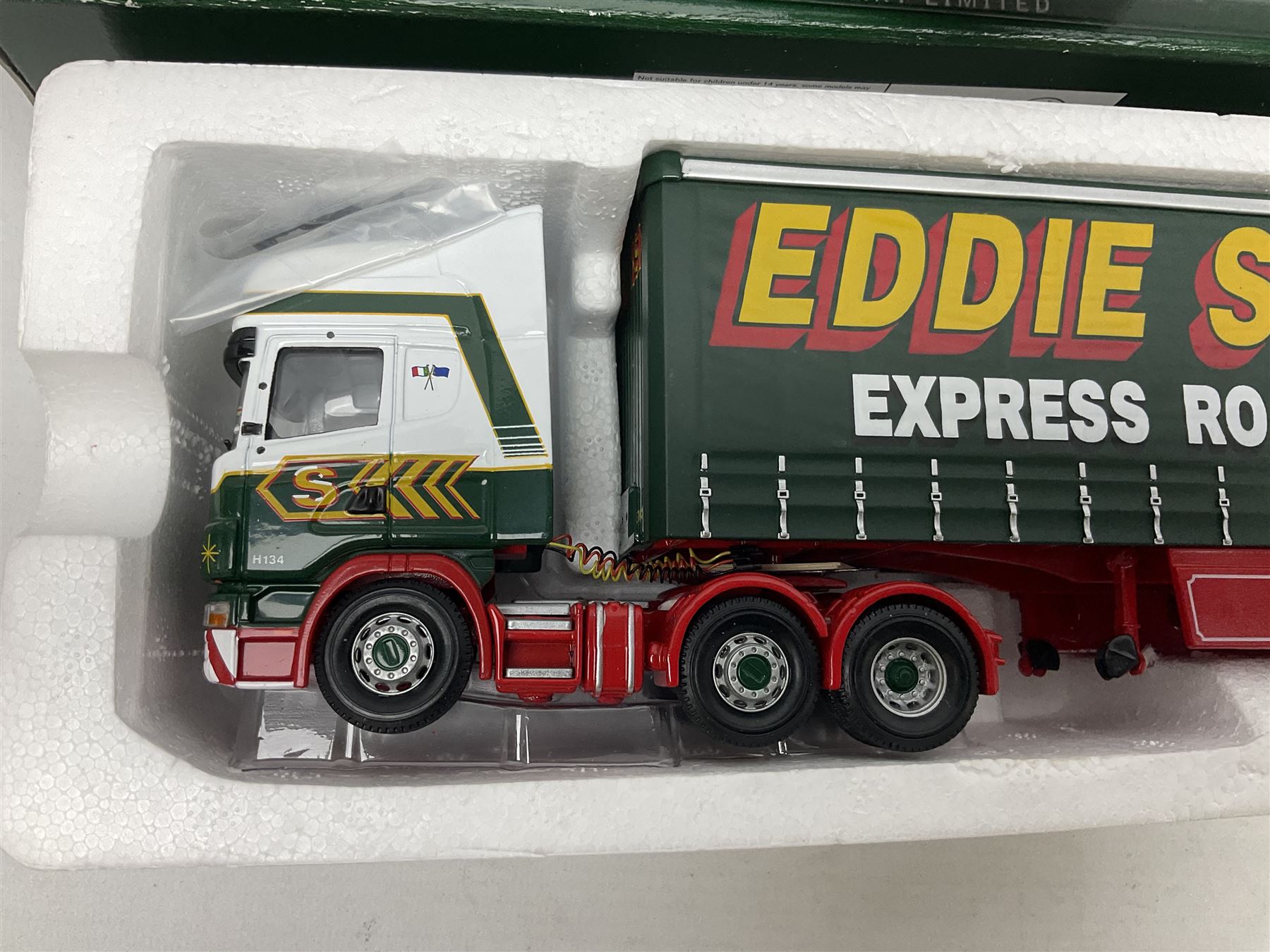 Corgi - three limited edition lorries comprising CC12901 Scania Topline Curtainside Eddie Stobart Limited; CC12104 Renault Premium Curtainside Strongserve Ltd; and 50703 Guinness Mack LJ with Fruehauf Trailer; all boxed (3)