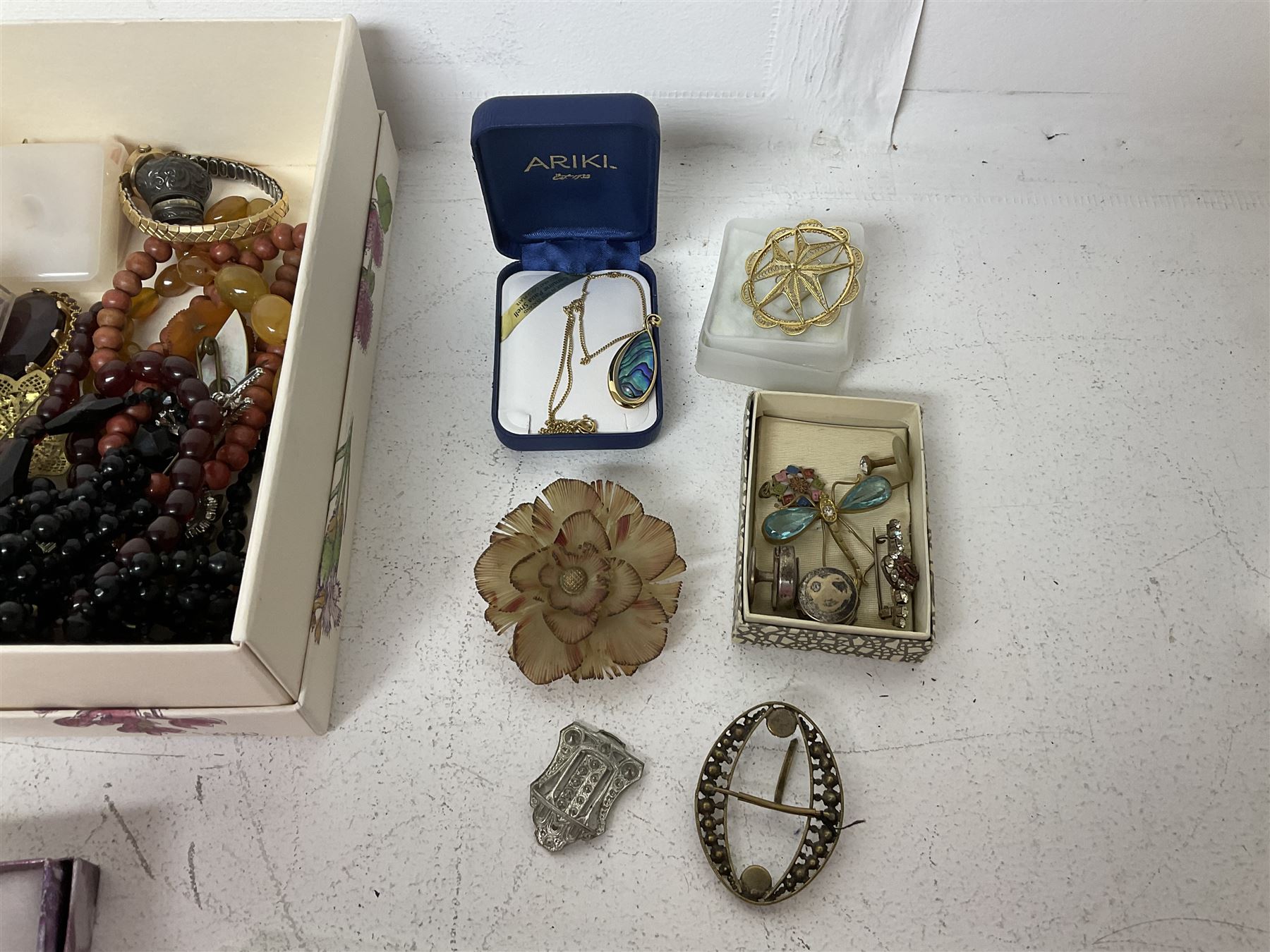 9ct gold St Christopher charm, together with a collection of costume jewellery including beaded necklaces, gold plated flat link bracelet and two wristwatches