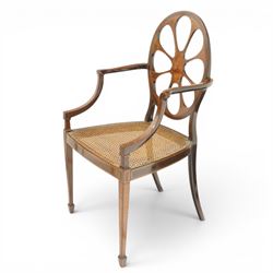 Hampton & Sons (Pall Mall 1830-1957) - Pair of Edwardian inlaid mahogany wheel-back elbow chairs, the pierced oval backs with chequered stringing and cross banding, out-swept arms over canework seats, banded seat rail over square tapering supports with spade feet, stamped to underside
Provenance: Kirkham Hall