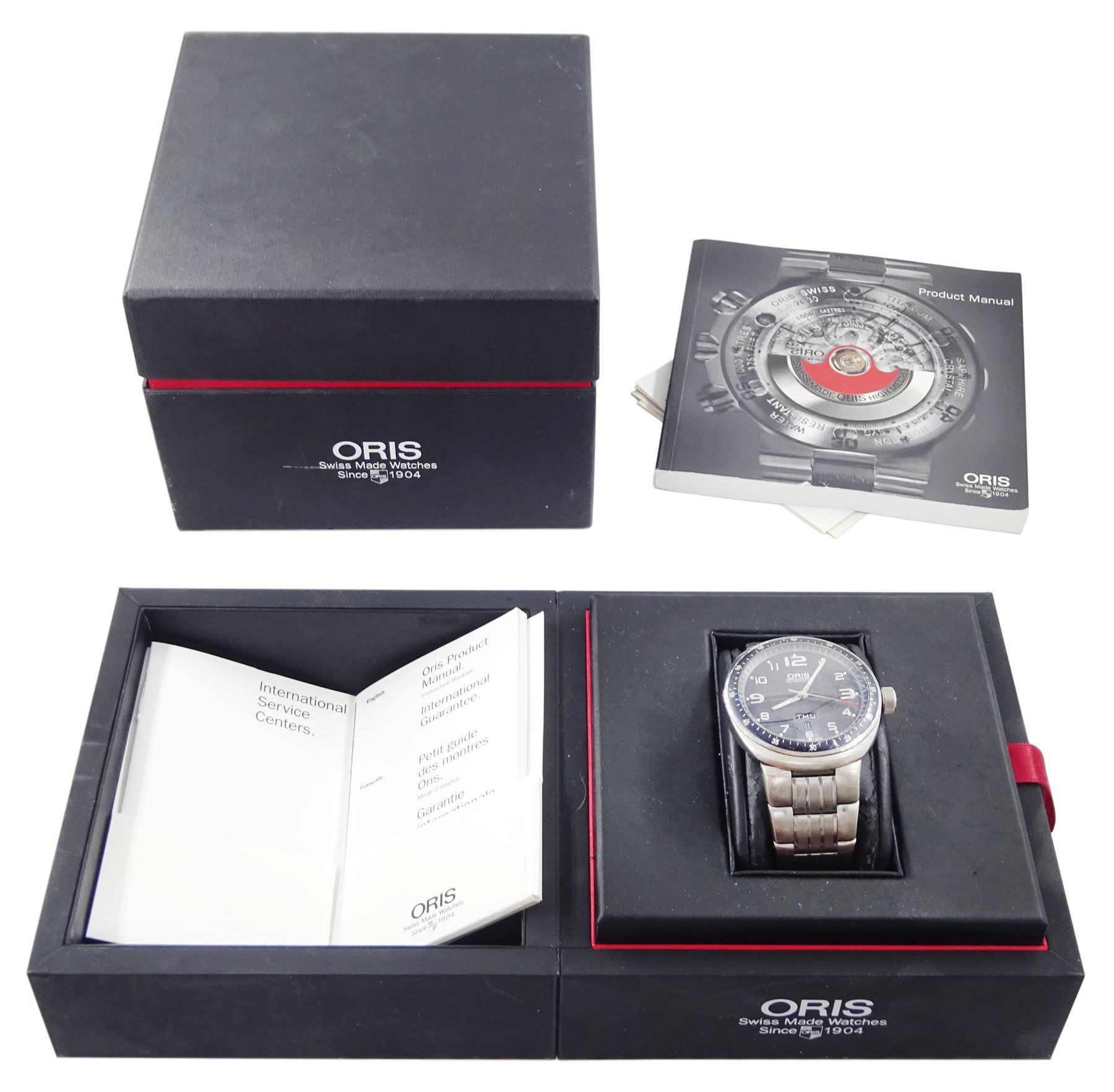 Oris TT3 gentleman's titanium automatic wristwatch, Ref. 7589, black dial with Arabic hour markers and day / date aperture, on original titanium bracelet, boxed with receipt dated 2009