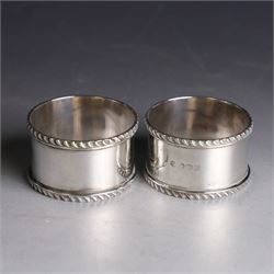 Pair of early 20th century silver napkin rings, plain circular form with oblique gadrooned rim, no engravings, hallmarked William Hutton & Sons Ltd, Sheffield 1912
