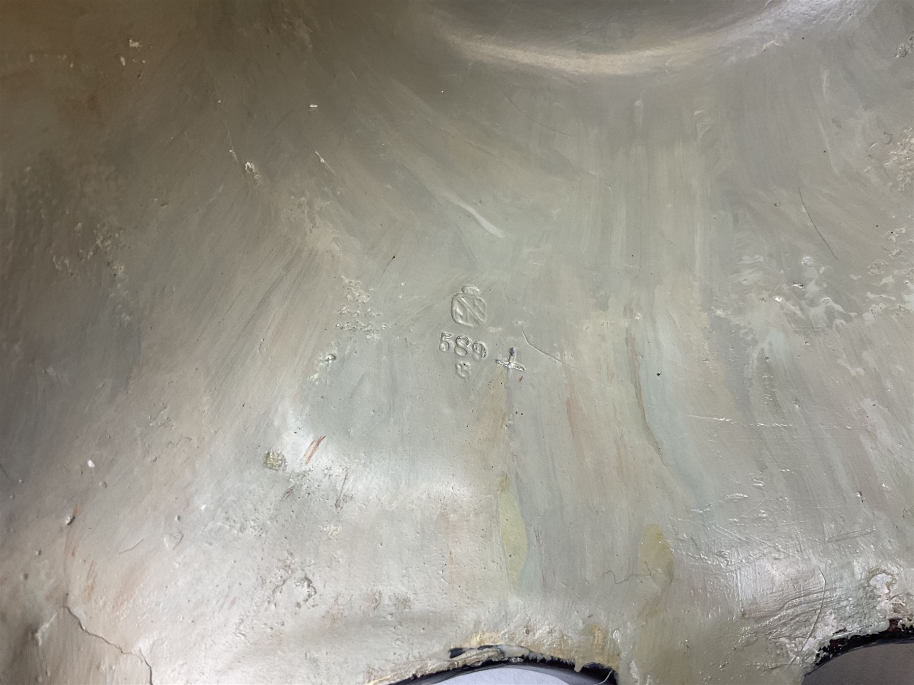 Composite table lamp modelled as a Roman Emperor donning blue robes, upon quatrefoil base modelled with rams heads and winged cherubs, H56cm excl fitting