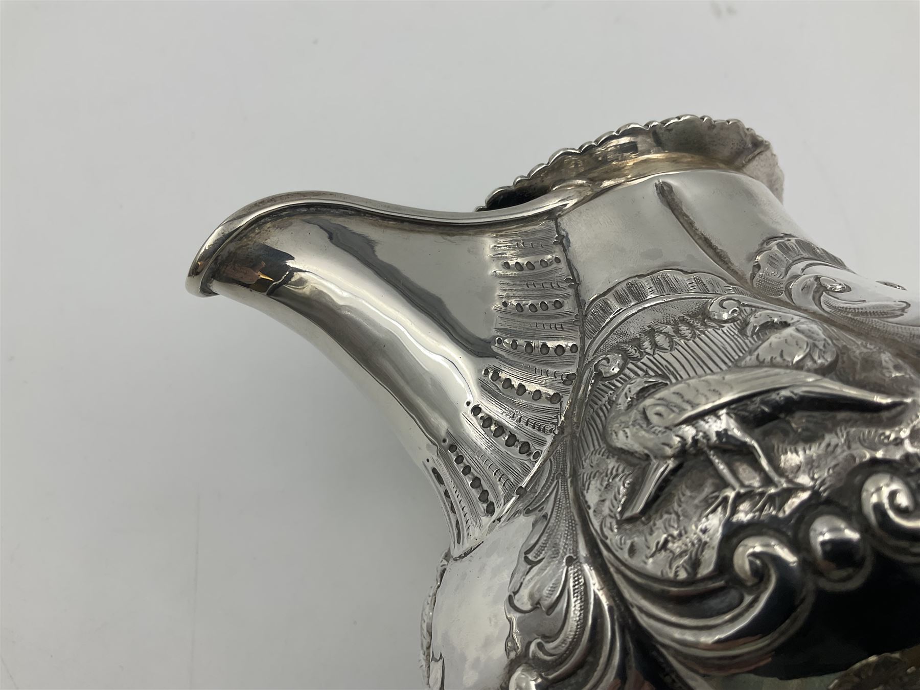 Victorian silver three piece tea service, comprising teapot, twin handled open sucrier, and milk jug, each of bellied form with acanthus capped scroll handles, the sides embossed with alternating scroll edged vacant panels and panels containing a pair of birds, upon four palmette feet, the teapot with ivory insulators to handle, and bird finial to the hinged domed cover, hallmarked William Hunter & Son, London 1861, teapot H19cm, including handles sucrier H13.5cm, including handle milk jug H12cm

This item has been registered for sale under Section 10 of the APHA Ivory Act