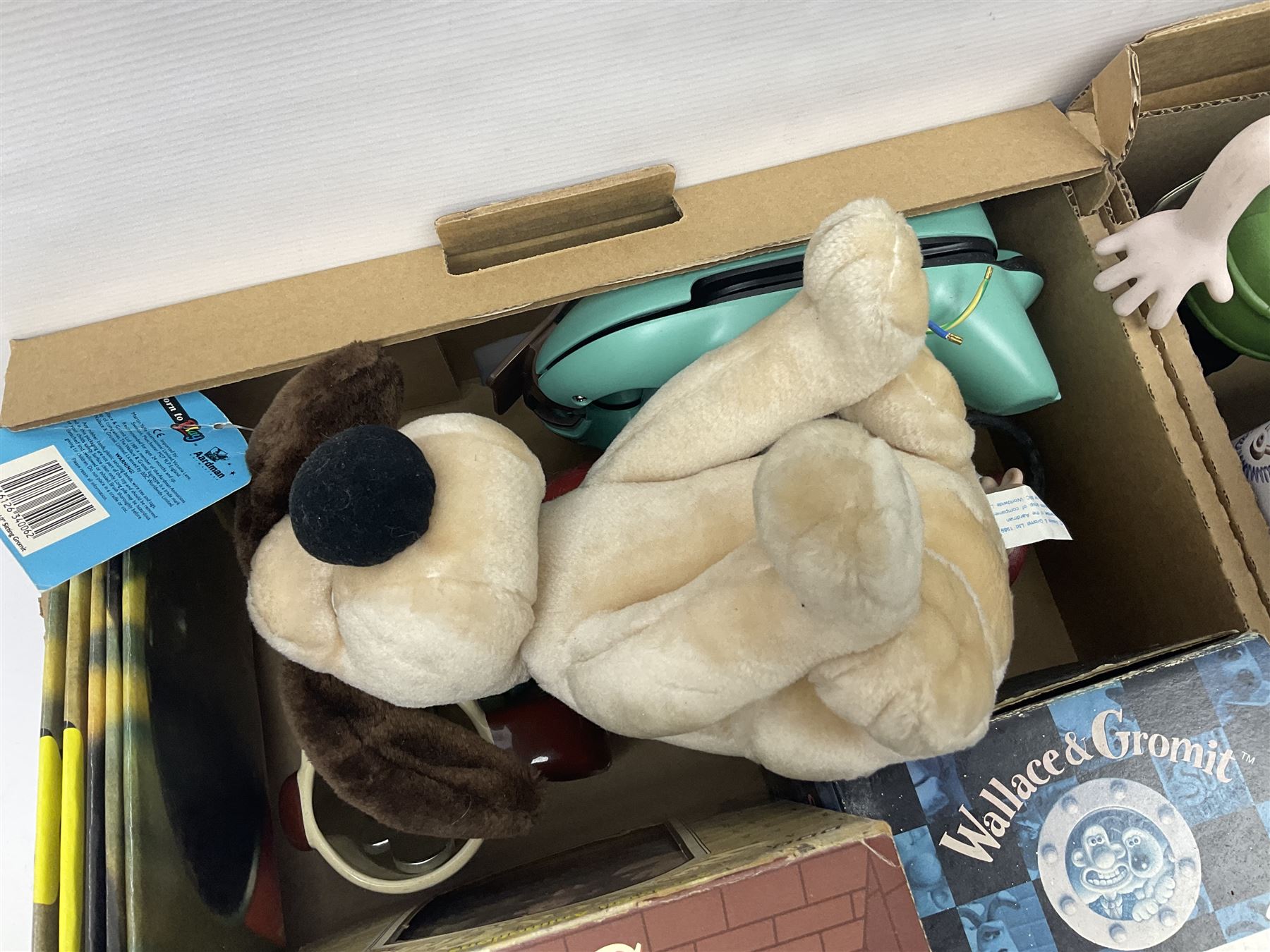 Wallace and Gromit and Shaun the Sheep collectables, including alarm clocks, plates, cafetiere, soft toys, etc, in two boxes