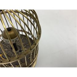 Automation bird cage of predominantly brass construction with central rotating orb and bird with painted decoration, H15cm