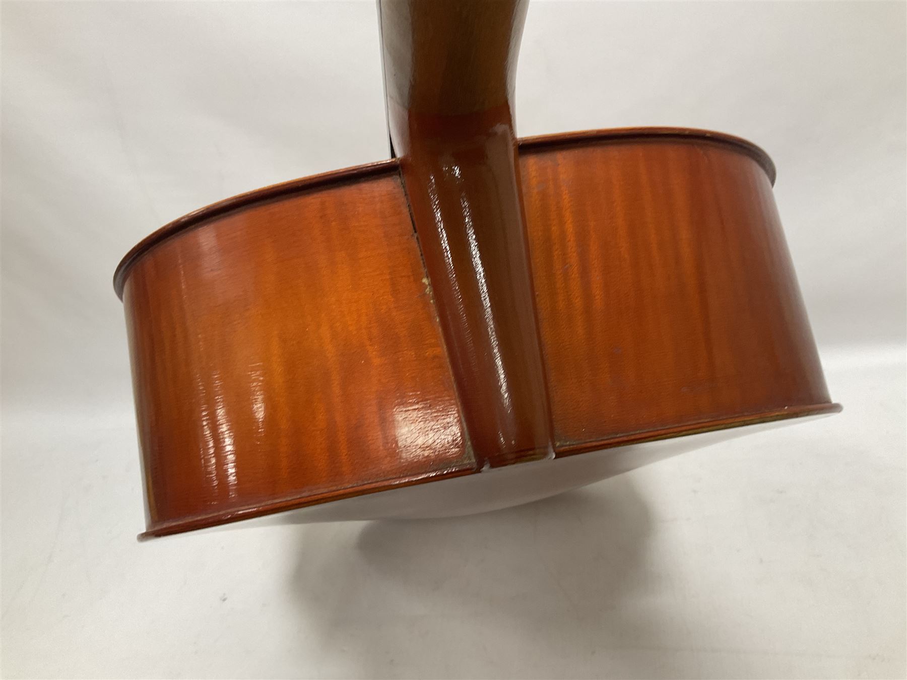 3/4 size cello with soft case, 69cm back length, 114cm full length, with bridge, ebonised tail piece and fingerboard.