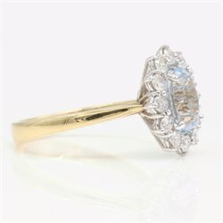 18ct gold aquamarine and diamond cluster ring, single oval cut aquamarine of approx 1.25 carat, surrounded by twelve round brilliant cut diamonds, hallmarked, total diamond weight approx 0.30 carat