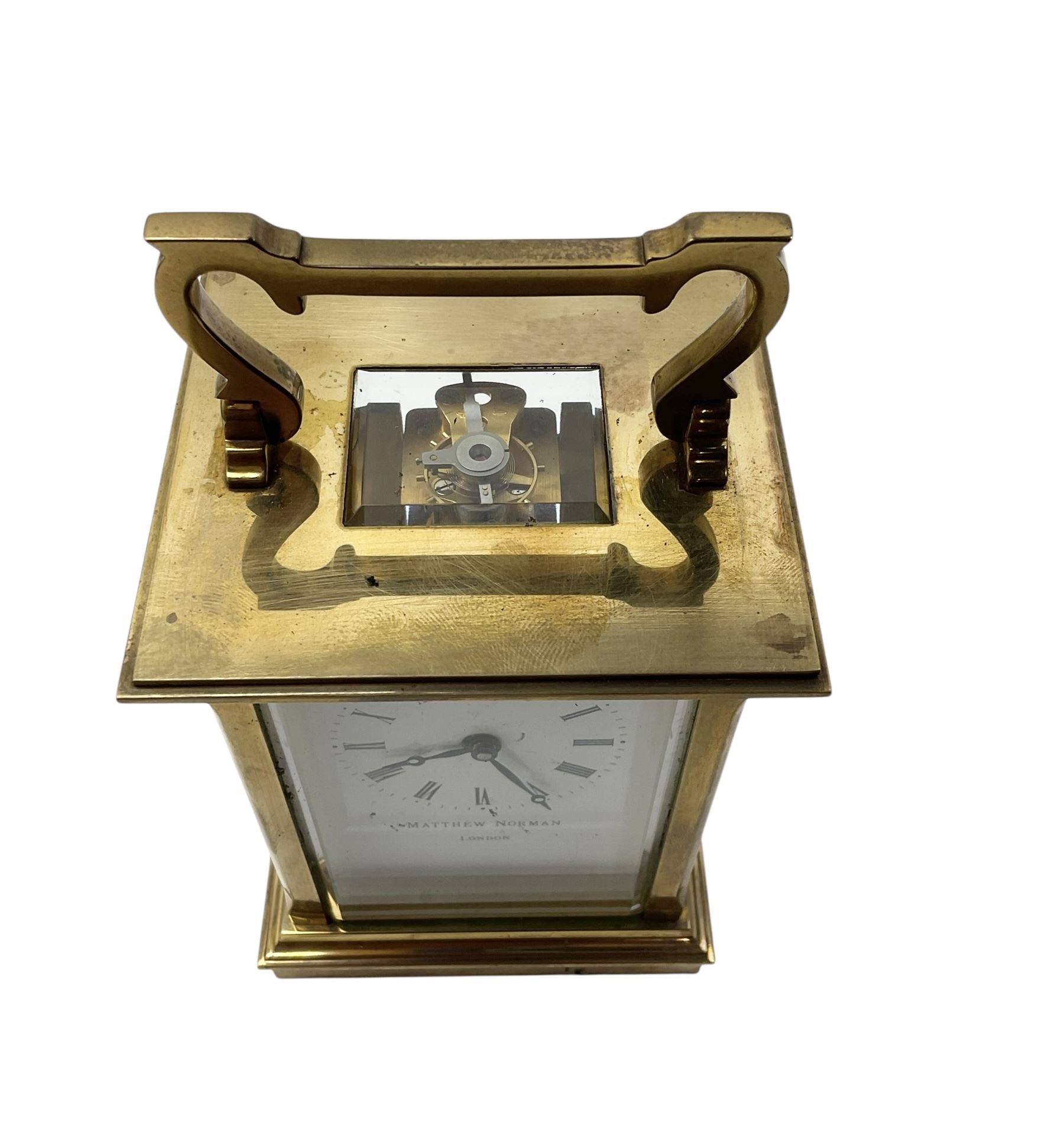 Matthew Norman-20th century brass cased carriage clock with an enamel dial, roman numerals and steel hands, single train timepiece movement with a lever platform escapement.