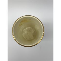 A Crown Devon Fieldings vase, of cylindrical form painted with a highland cattle scene and signed Cox, with printed marks beneath, H11.5cm