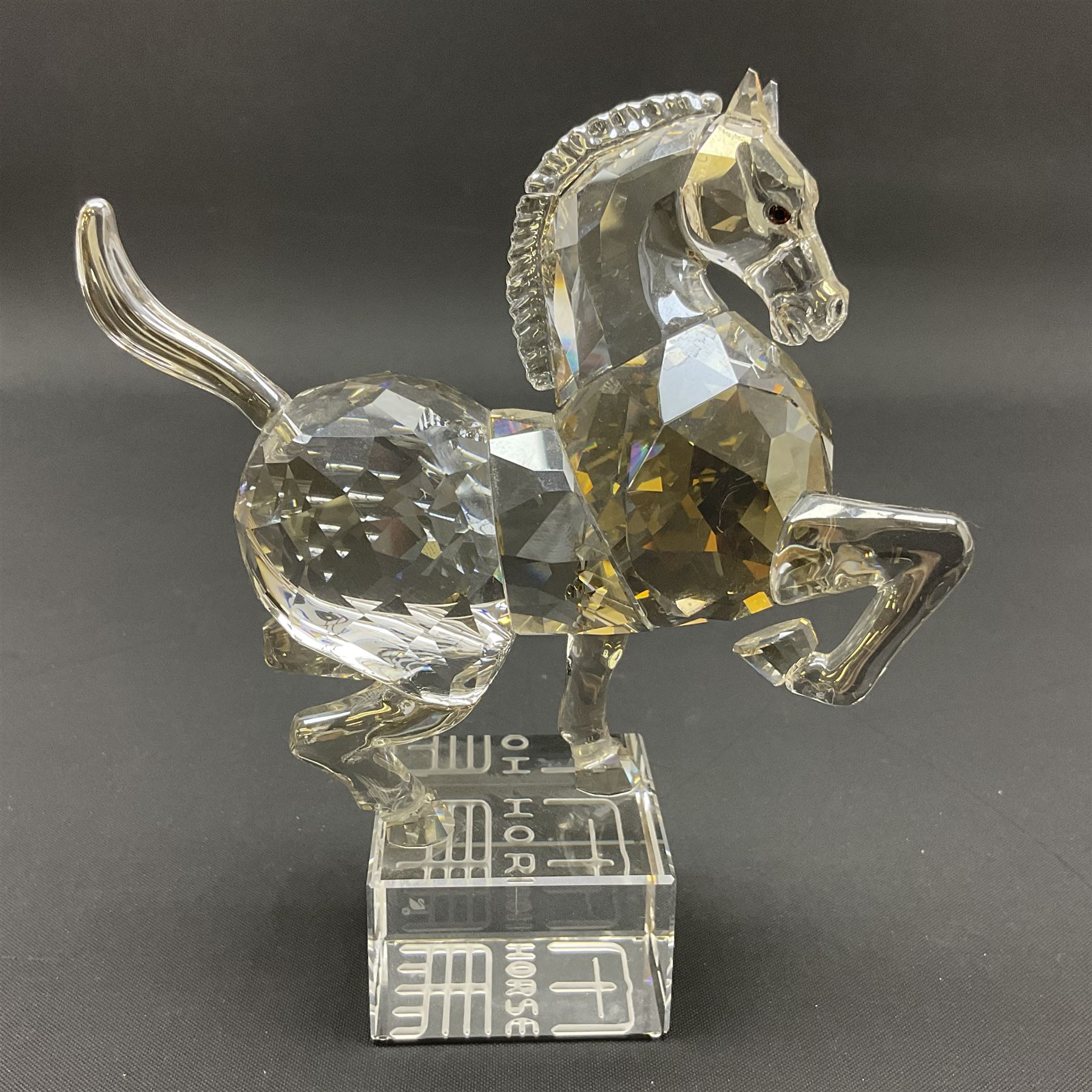 Two Swarovski Crystal Signs of the Zodiac figures, comprising horse and tiger, together with Zodiac dragon holding the flaming pearl, largest H11cm 
