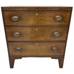 Regency mahogany chest, rectangular top with ebony stringing, fitted with three graduating cock-beaded drawers, each with pressed brass oval handle plates with scrolling anthemion detail and bone escutcheons, raised on bracket feet