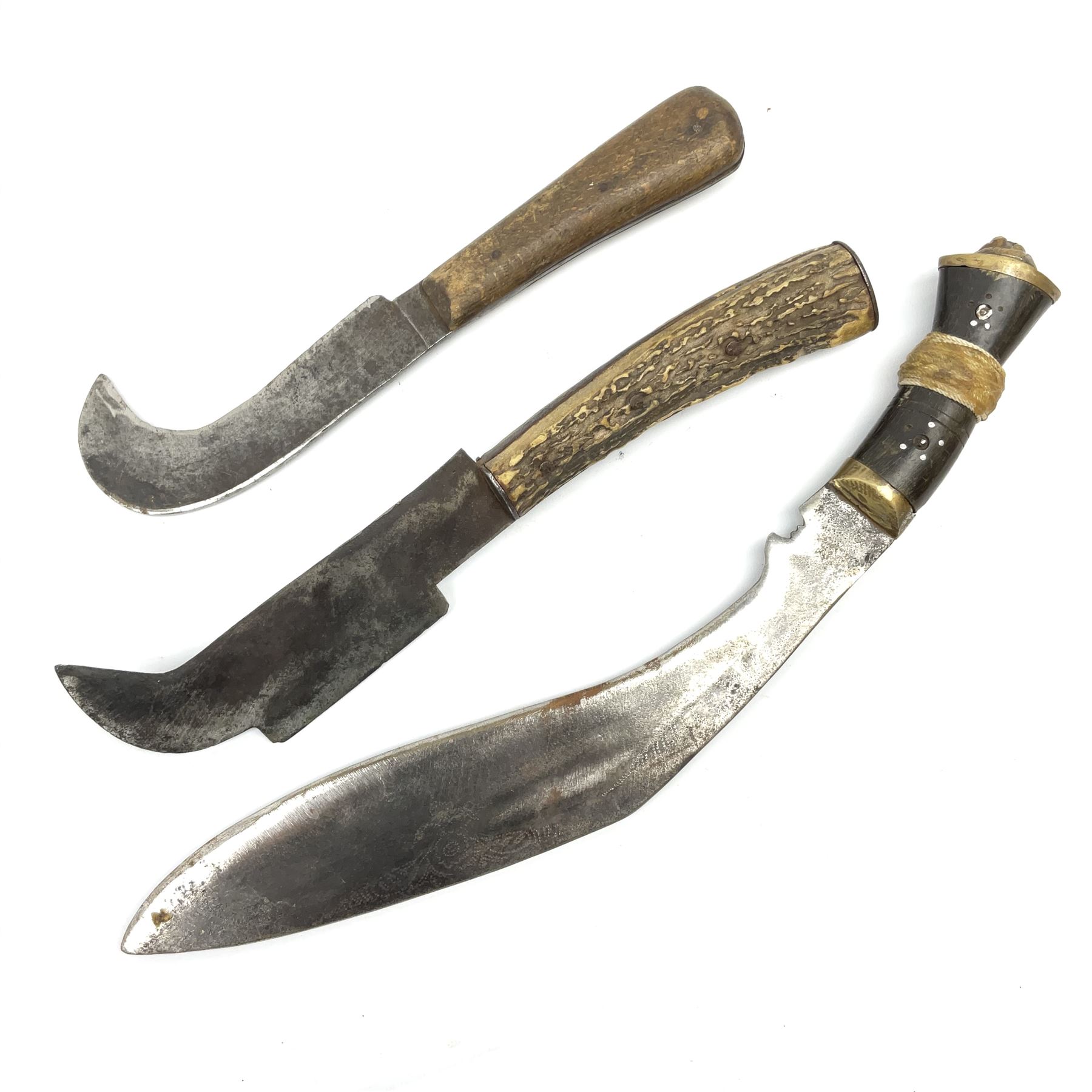 Two late 19th/early 20th century billhooks - one blade marked 'Brumby & Middleton' with Victoria cypher and antler grip L30.5cm, the other blade marked 'The Veteran Yates & Co Birmingham' with Calcutta retailer's mark to the ricasso and split wooden grip L26.5cm; together with an Indian kukri (3)