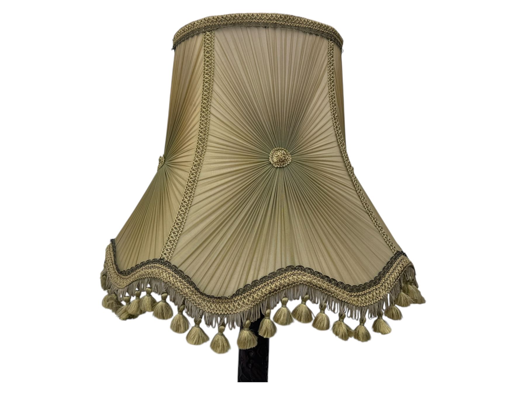 Early 20th century floor lamp, with fringed and pleated silk shade over a carved and turned column, on a circular stepped base