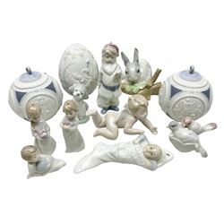 Seven Lladro figures, comprising A Friend for Life no 7685, Playing Cherub no 6254, Santa Clause no 5842, Baby's First Christmas no 6037, First Christmas together no 5923, Christmas Morning no 5940 and Rabbit Eating no 4773, together with two Lladro Christmas 1988 Balls and Lladro 1994 Easter egg, all with original boxes, largest example H9cm 