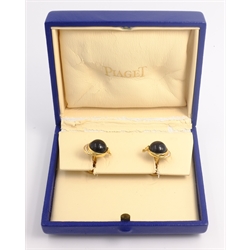  Pair of Piaget 18ct gold diamond and black onyx cuff-links, racing jockey cap design, stamped Piaget 1993 750  
