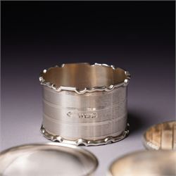 Three engraved silver napkin rings and four others (7)