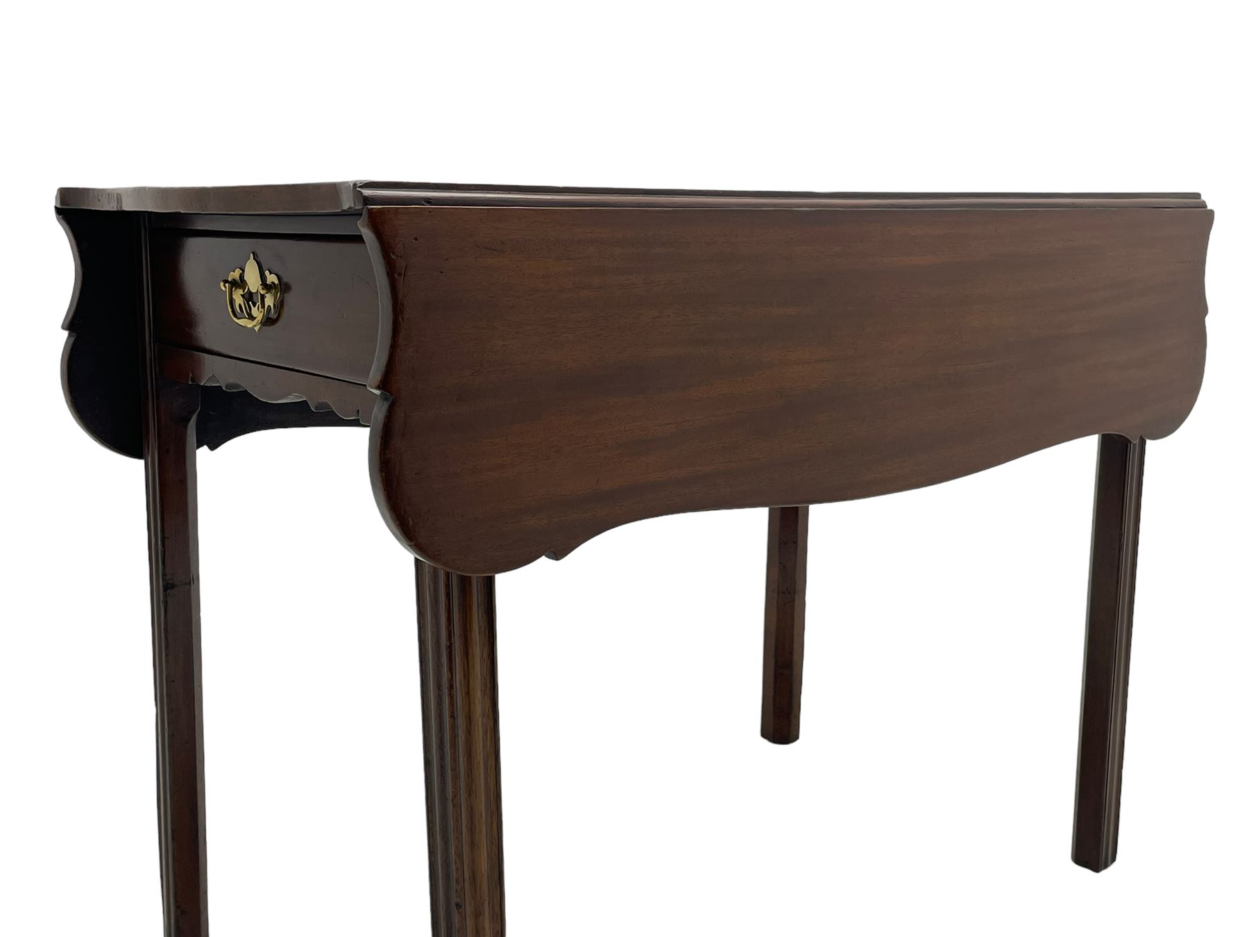 George III mahogany serpentine Pembroke table, the shaped drop-leaf top over single end drawer and shaped end rails, on square moulded supports