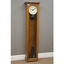  Early 20th century oak cased electric master clock, arched glazed door, silvered Arabic dial, with pendulum, H137cm  