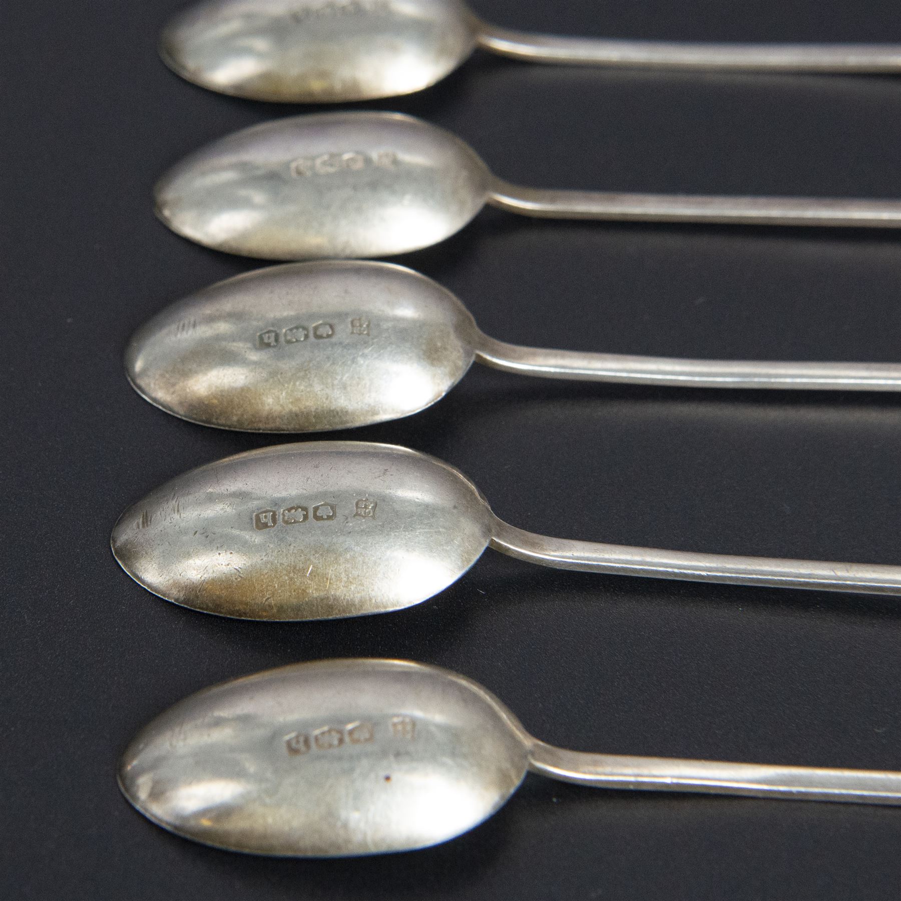 Five silver napkin rings, including pair of 1930s oval examples, with engine turned decoration with engraved initial, together with a collection of silver flatware, including Norwegian spoon, pair of Fiddle pattern mustard spoons, five seal top coffee spoons, etc, all stamped or hallmarked