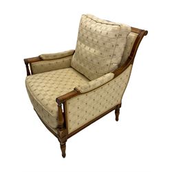 Wesley Barrell - beech framed armchair, upholstered in floral patterned fabric, on turned supports