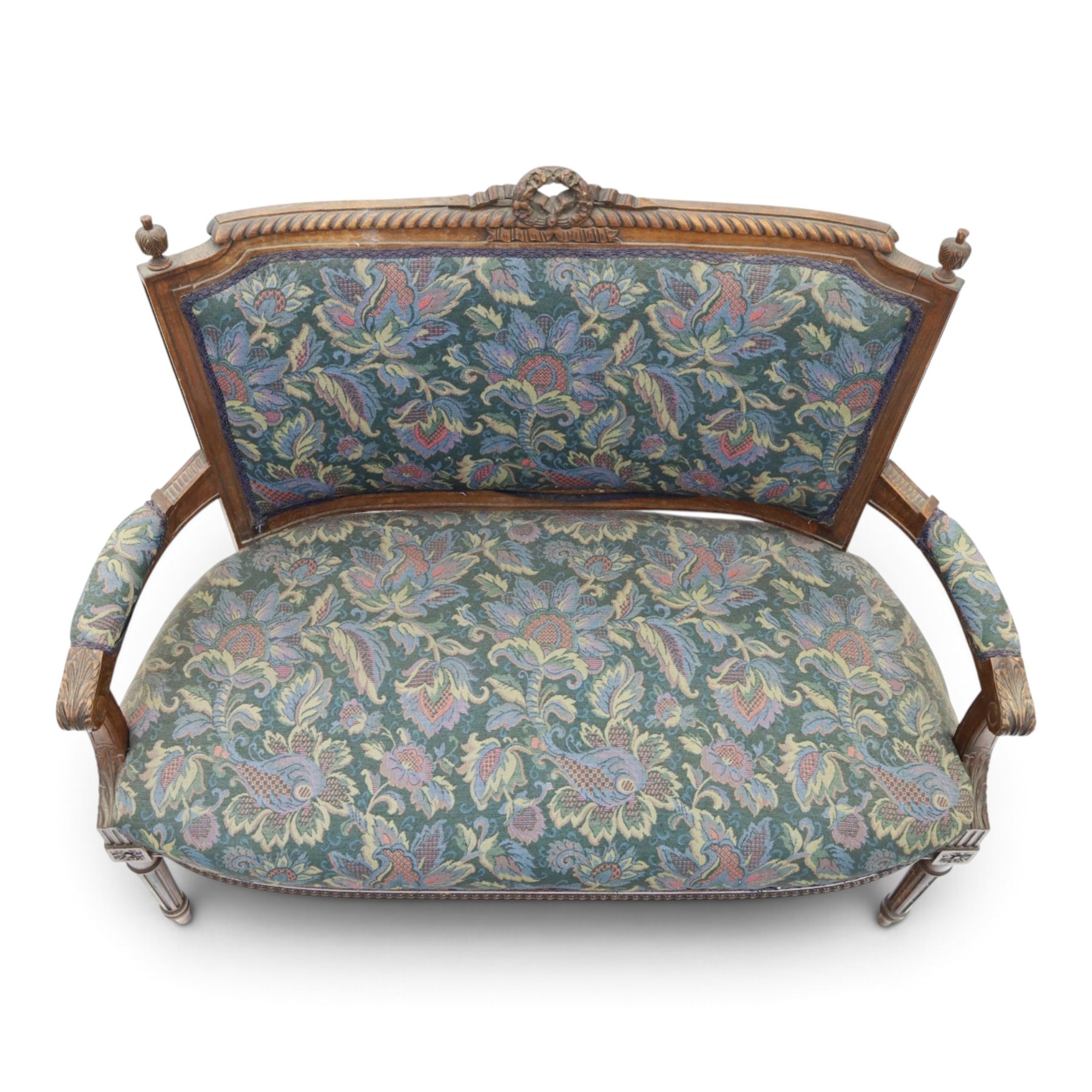 20th century French Louis XVI style stained beech two-seat salon settee, rectangular upholstered back and seat in floral tapestry fabric, carved and moulded frame with foliate cresting, padded open arms and fluted tapering supports