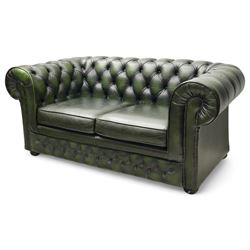 Thomas Lloyd - two-seat hardwood-frame Chesterfield sofa, traditional rolled back and arms upholstered in deeply buttoned green leather, on turned bun feet 