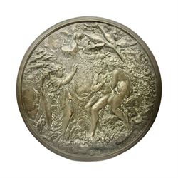 Late 19th century bronze plaque, of circular form, depicting the angel appearing to Adam and Eve in the garden of Eden in high relief, D25.5cm
