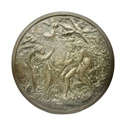 Late 19th century bronze plaque, of circular form, depicting the angel appearing to Adam and Eve in the garden of Eden in high relief, D25.5cm
