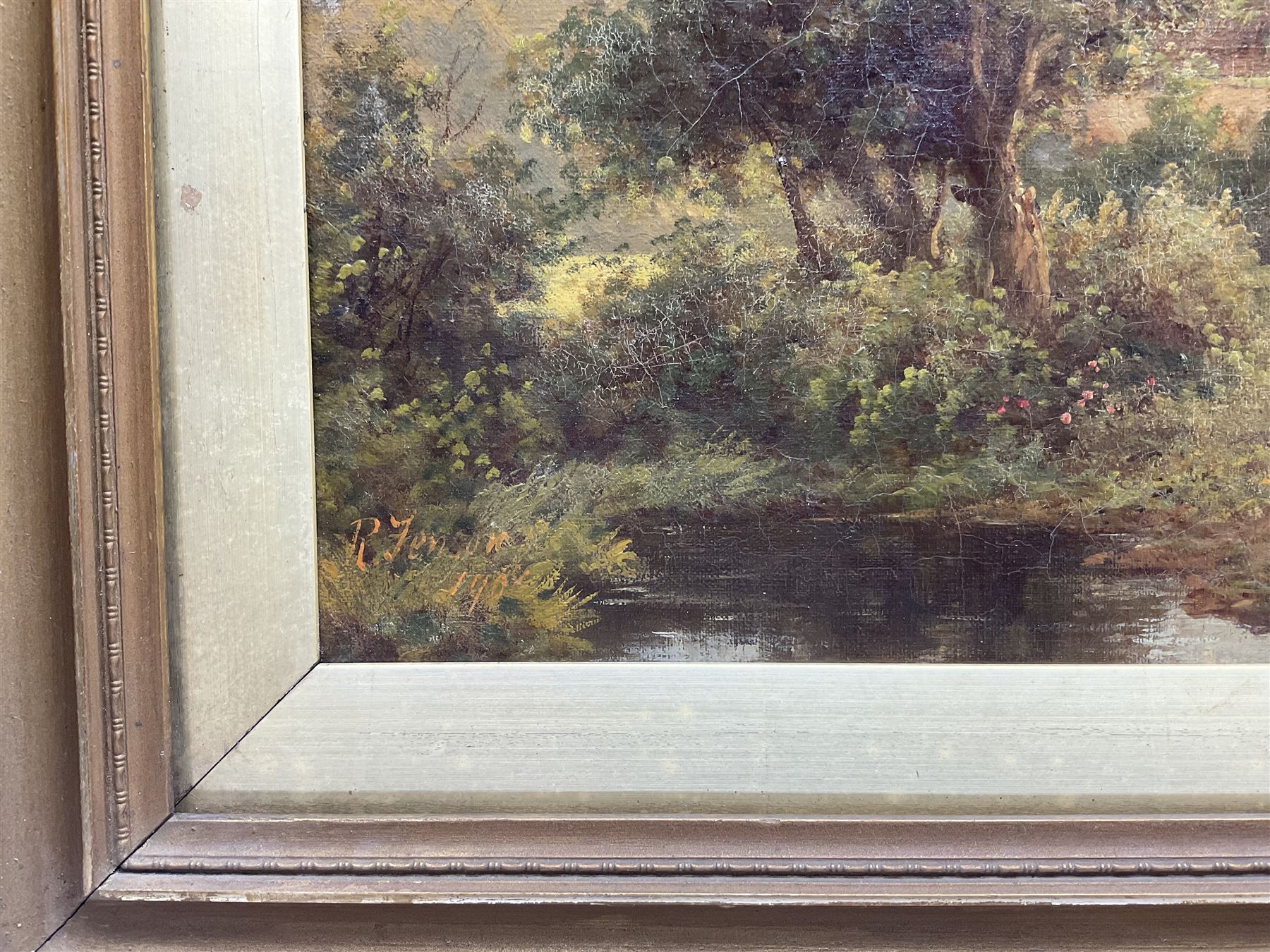 Robert Fenson (British 1889-1915): Couple Tending to the Farm Animals, oil on canvas signed and dated 1908, 29cm x 60cm 