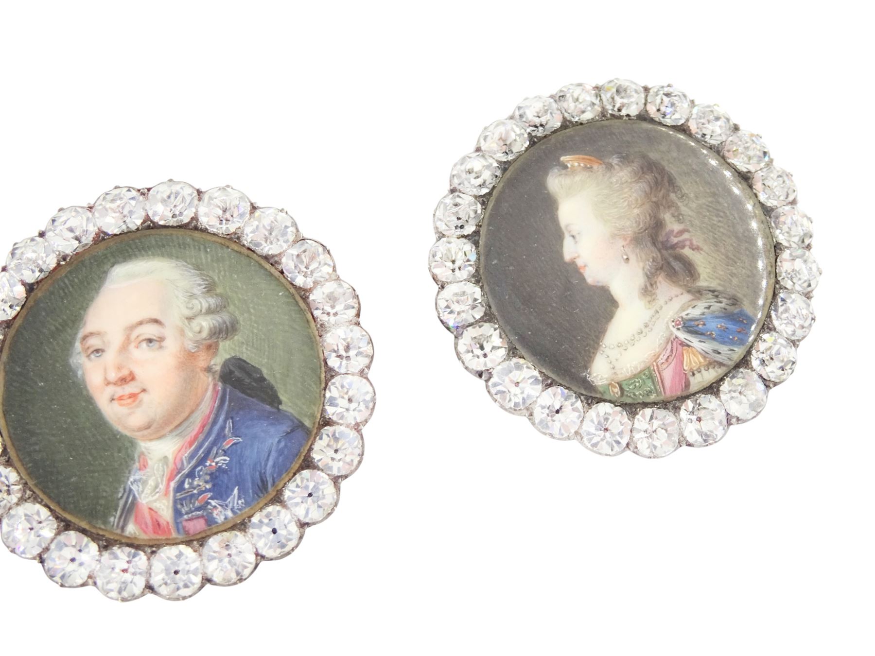 Set of six late 18th century French portrait miniature buttons, each finely painted upon ivory with a likeness of notable figures of the French Royal Court, set under glazed panels within silver frames mounted with paste stones, engraved verso with the sitters’ names and fitted with eyelets, later adapted with suspension rings; comprising “LE ROY” (Louis XVI), “LA REINE” (Marie Antoinette, youth portrait), “LA REINE” (Marie Antoinette, mature portrait), “MADAME” (Maria Josepha of Savoy, 1771–1810, wife of Louis, Comte de Provence, later King Louis XVIII), “M. BAILLY” (Jean Sylvain Bailly, 1736–1793, Mayor of Paris), and “M. L’ABBÉ MAURY” (Jean-Siffrein Maury, 1746–1817, Cardinal and Archbishop of Paris), overall D3.5cm. This lot has been registered for sale under Section 10 of the APHA Ivory Act
