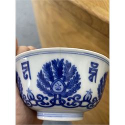 Qing dynasty bowl decorated in blue and white with palmettes and interlocking scrolls with a siddham script border, four character mark D10cm