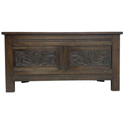 Early 20th century oak blanket box, hinged top over panelled front carved with scrolled acanthus leaves, moulded horizontal rails, on stile supports