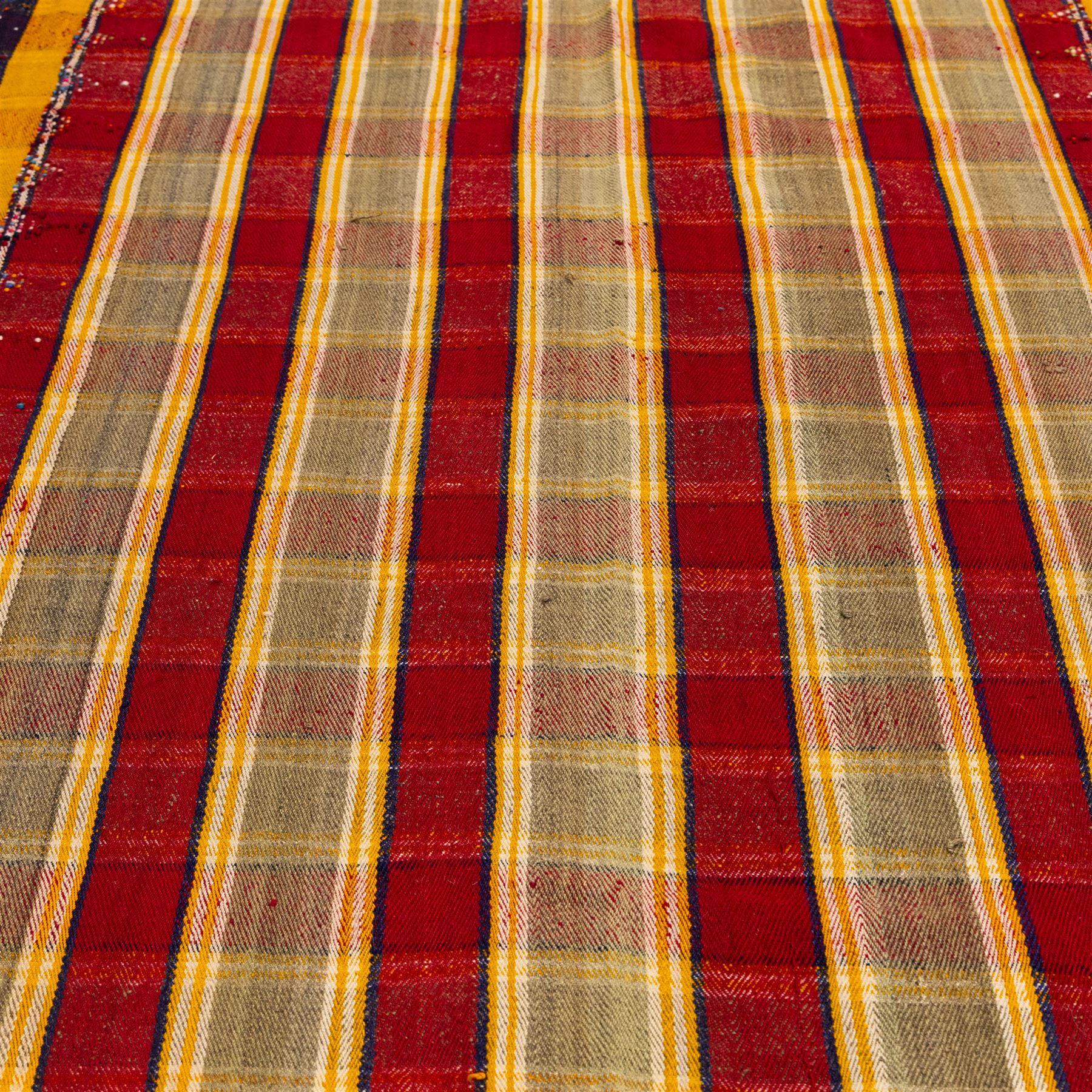 South West Persian Jajim flatweave kilim, field with alternating vertical bands of red, yellow, navy and pale green, decorated with geometric and polychrome raised pile accents, fringe ends 