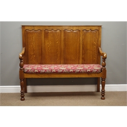  17th century style oak settle with ogee pointed arched fielded panel back, turned supports, with floral seat cushion, W136cm, H115cm, D53cm  