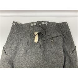 Pair of WW2 German Other Ranks trousers c1940-42, stamped C.& A. Brenninkmeyer Workstatten; WW2 German Army webbing belt with steel 'Gott Mit Uns' buckle; and WW2 German leather belt with 'Stahlhelm' (Steel Helmet League) members buckle (3)