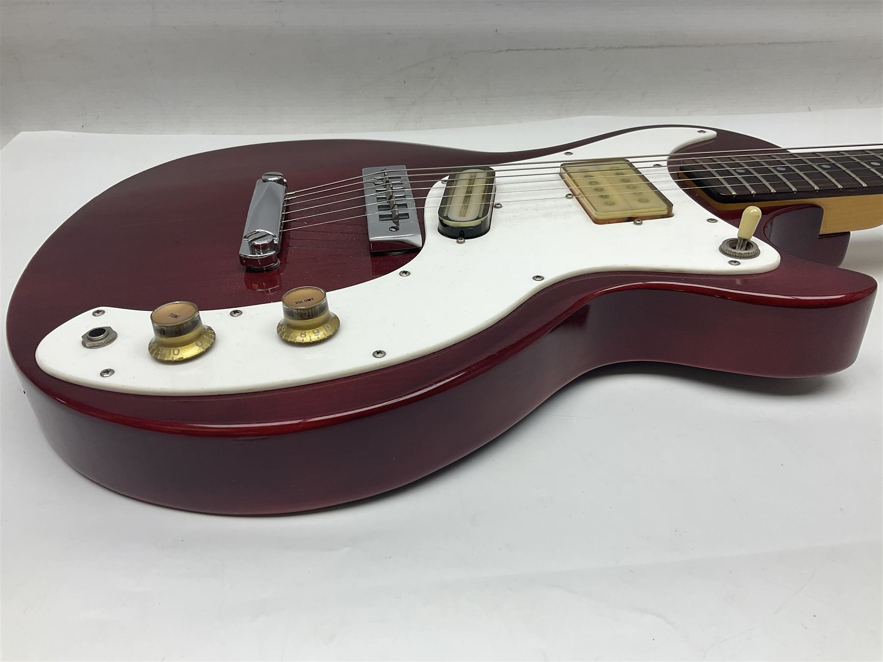 Gibson Marauder style six-string electric guitar with cherry coloured body, marked made in Japan L101cm; in locking hard carrying case