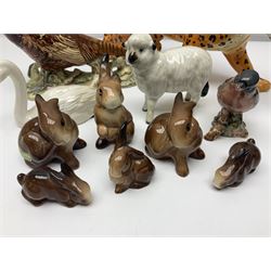 Group of Beswick figures to include leopard no 1082, rabbits, swan, pheasant no 1226 etc, all with marks beneath