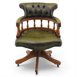 Late 20th century swivel captain’s desk chair, green buttoned vinyl upholstered back and s...