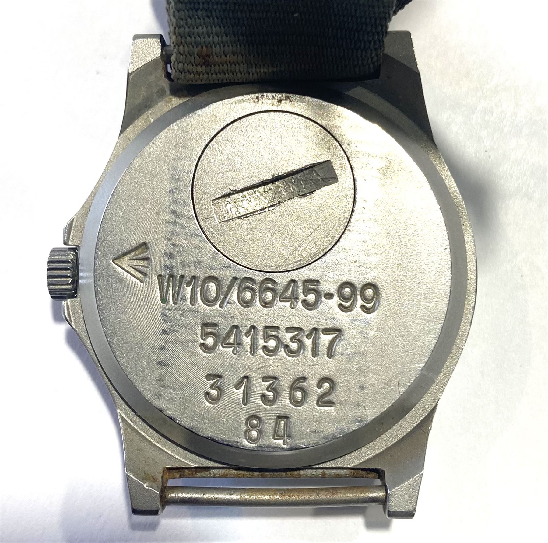 CWC Quartz British Military Army issue stainless steel gentleman's wristwatch, black enamel dial, with broad arrow, circled 'T' for Tritium and date aperture, back case stamped W10/6645-99 5415317 31362 84, on fabric strap