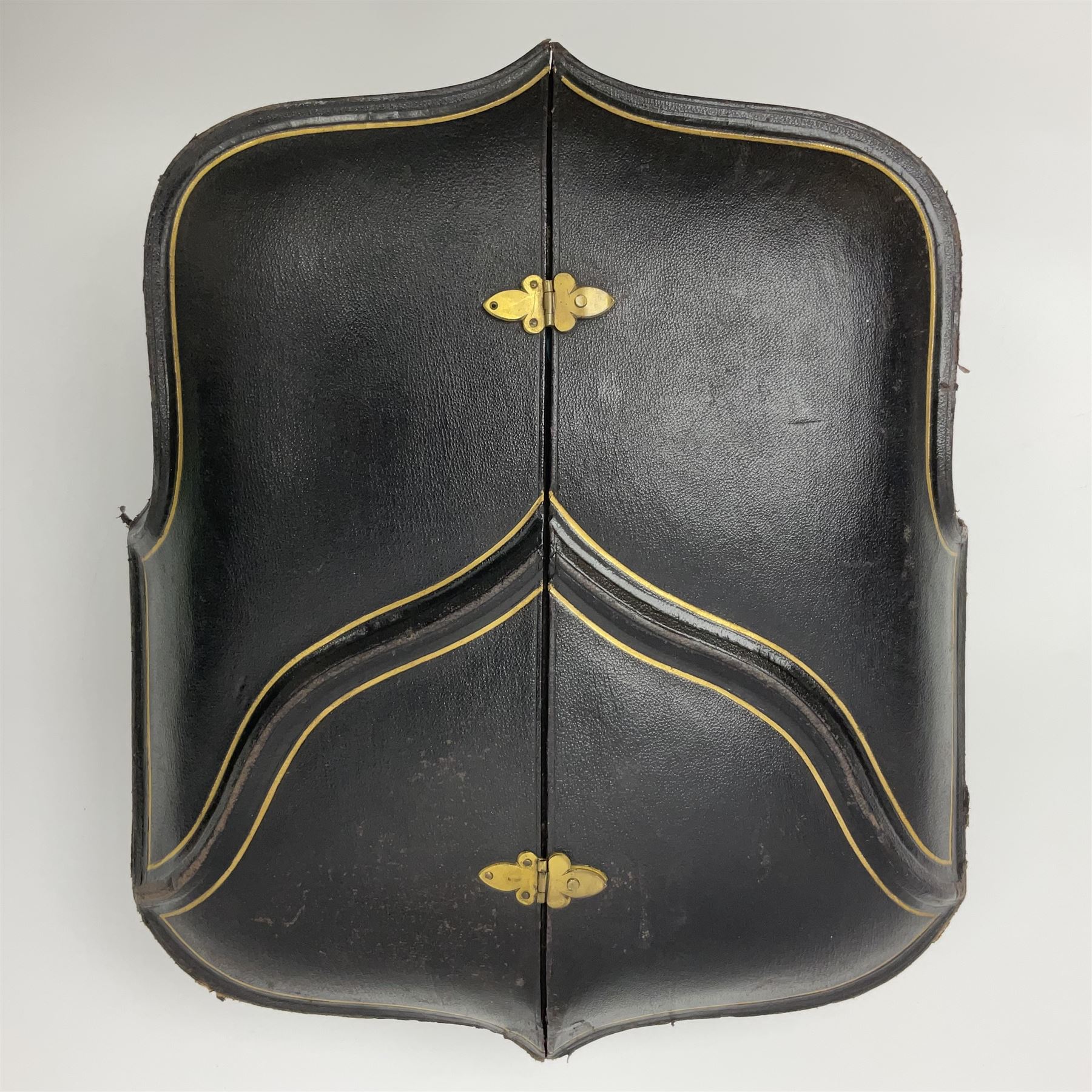 Victorian three-piece silver tea service, comprising teapot, twin handled open sucrier and milk jug, of oval form with shaped rim and C handles, each engraved with crests and bands of strapwork decoration, the milk jug and sucrier with gilt interiors, hallmarked Josiah Williams & Co, Exeter 1881, the teapot with ivory insulators and finial, all contained with a tooled leather, blue silk and velvet lined fitted case, retailed by West & Sun, Dublin 
This item has been registered for sale under Section 10 of the APHA Ivory Act