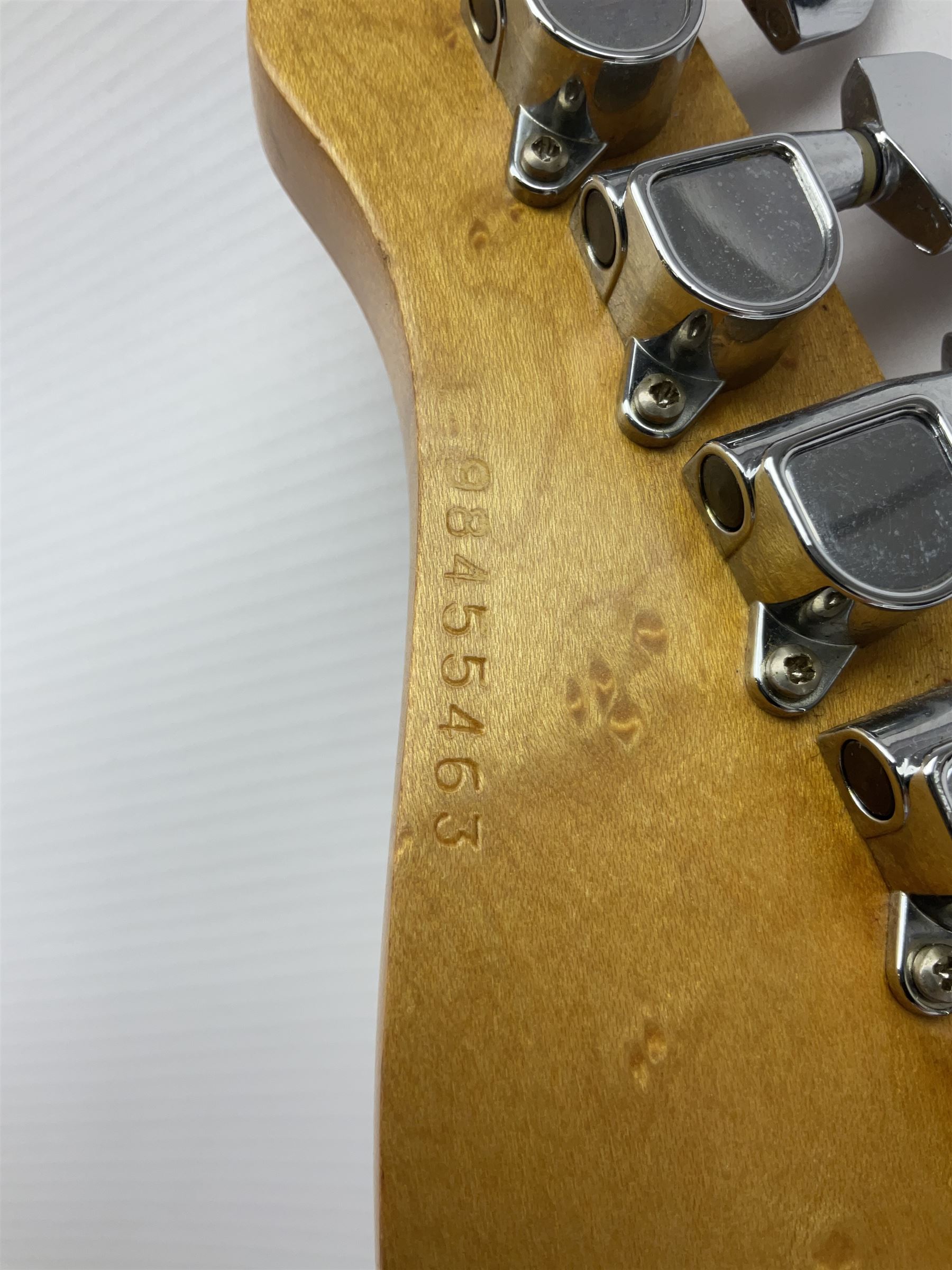 Canadian Godin SD electric guitar in two-tone purple/white with bird's eye maple neck and tremolo, serial no.98455463, L100cm overall; in soft carrying case.