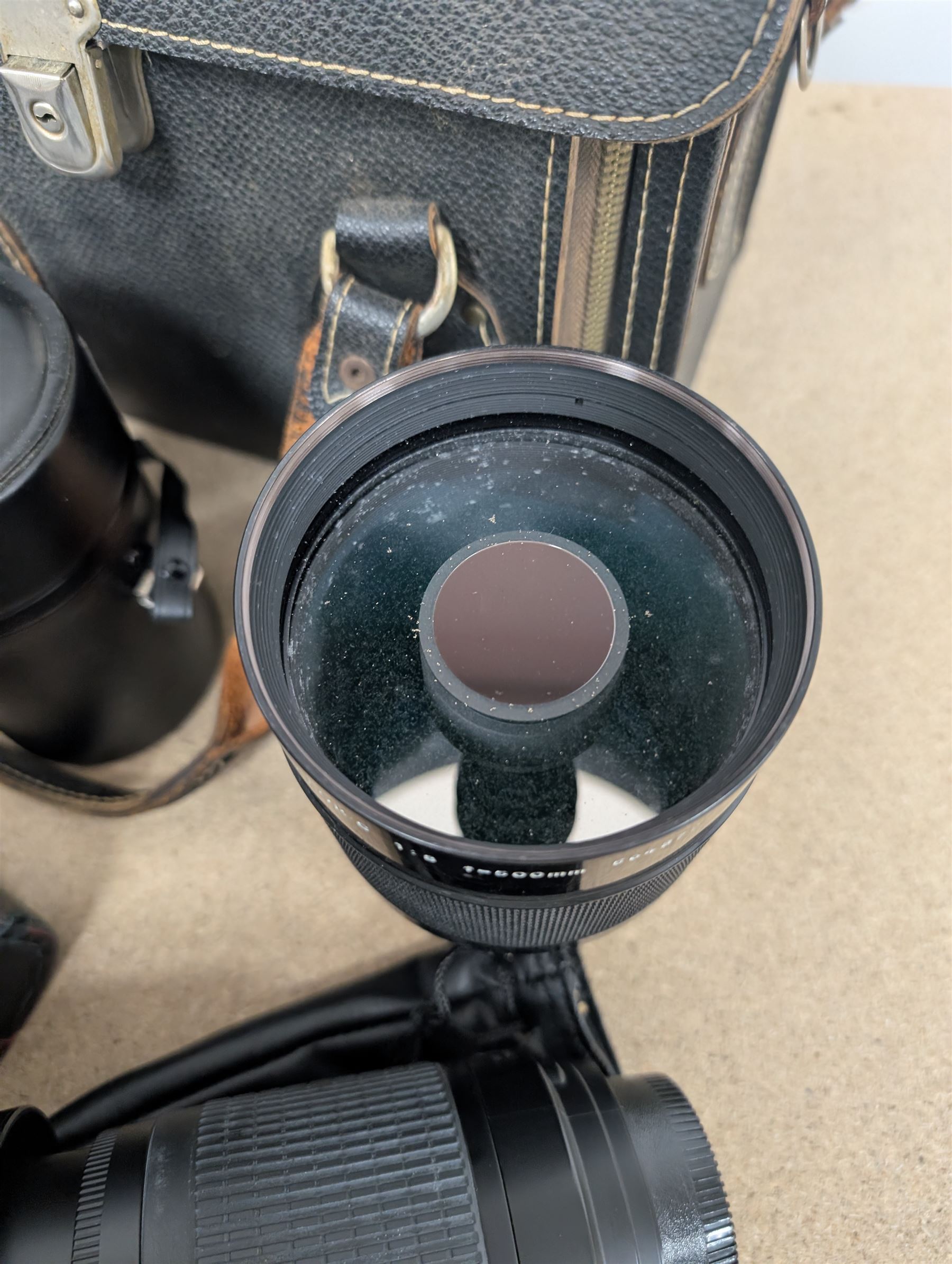 Kodak Dakon II folding camera and a collection of camera lenses and accessories, including Reflex-Nikkor  1:8 f=500mm, NikoN AF Nikkor 70-300mm 1:4-5.6G, Micro TM monocular lens and Teleshot adapter, two cases, Weston exposure meter, two cases etc