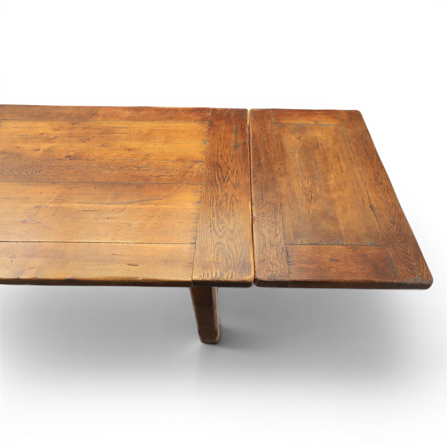 Country pine draw leaf table, bench seat and six chapel chairs, the top of plank construction, with two frieze drawers, additional leaves extending to 320cm, with bench seat and six elm chapel seats