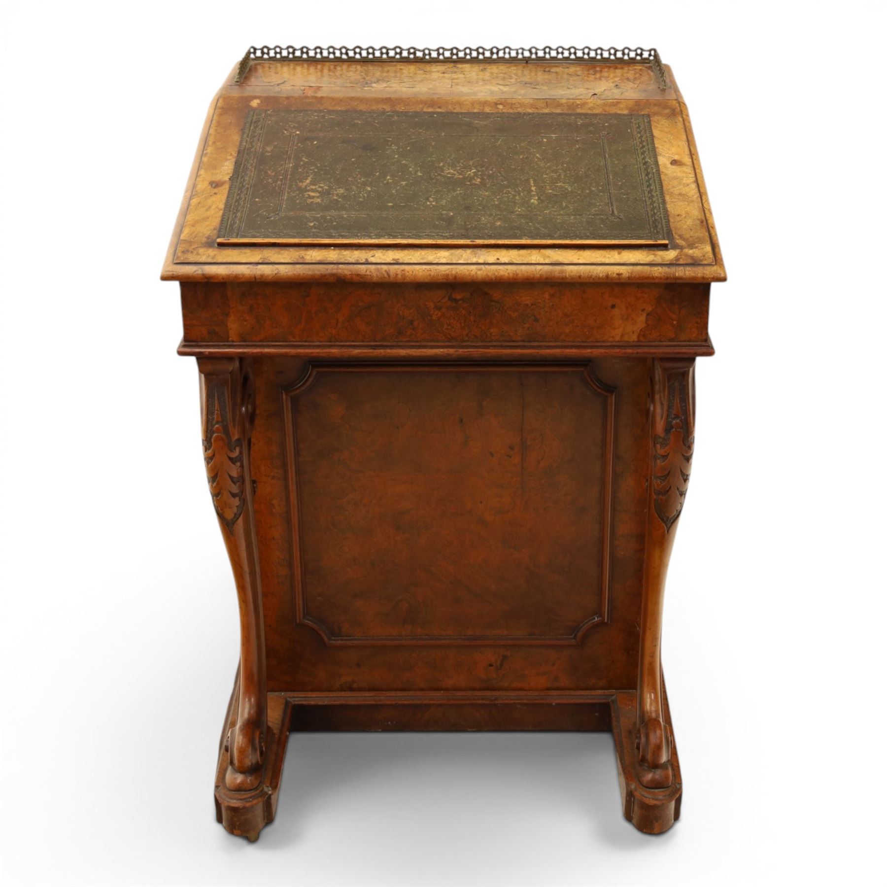 Victorian figured walnut Davenport, the fixed fall with drawer to the side enclosing writing compartment, green tooled leather writing inset, galleried back rail, right side fitted with four drawers behind a panel, opposing panelled side, raised on carved cabriole front supports with scroll terminals and platform base