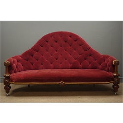  Victorian walnut framed high back sofa, upholstered in red velvet fabric with deep buttons and golden trim, carved and reeded apron and supports, L200cm  
