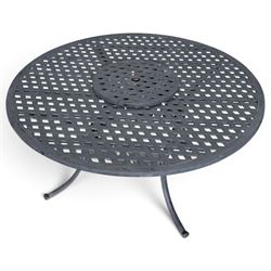 Grey-painted cast metal garden dining suite, comprising circular latticework table on splayed supports (W152cm H72cm), and six matching open armchairs with lattice backs and seats (W61cm H93cm)