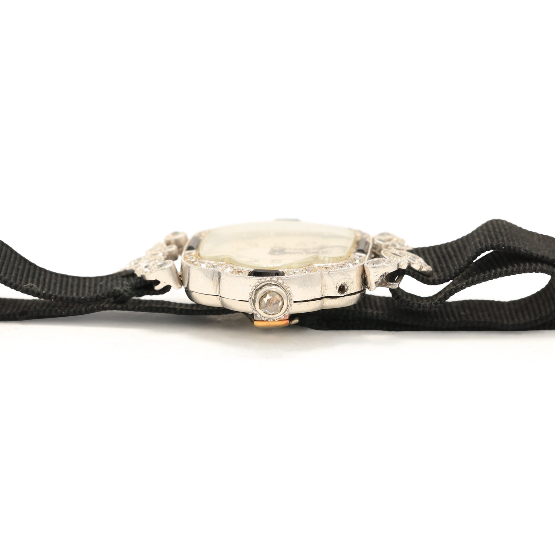 Art Deco French ladies platinum black onyx and diamond manual wind wristwatch, silvered / white dial with Arabic hour markers, old cut diamonds and onyx set bezel, diamond set lugs and crown, case No. 80639, hallmarked