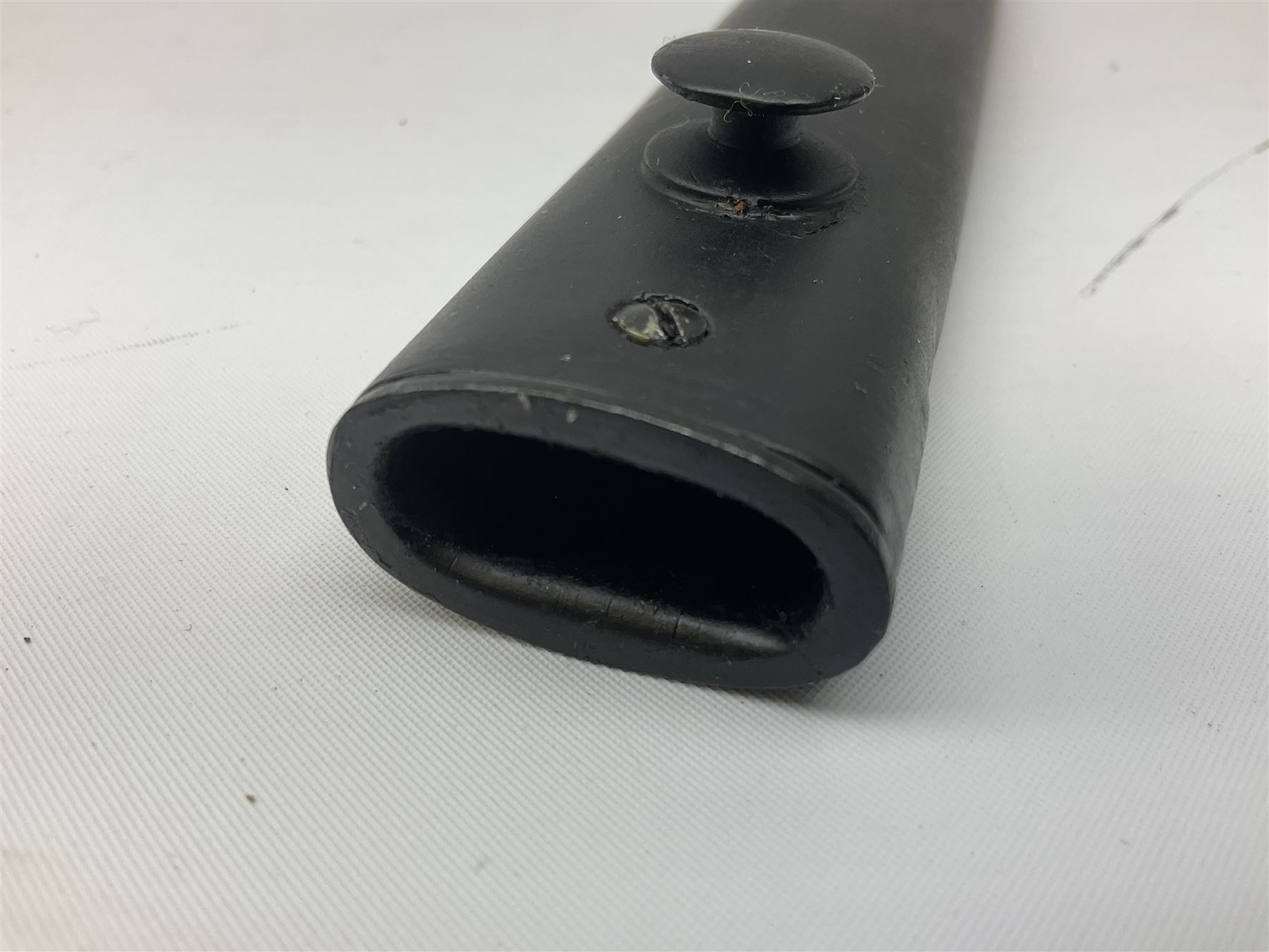 British Army L1A3 SLR Self Loading Rifle bayonet, with 20.5cm Bowie type fullered blade, hooked pommel with working push release button, grip secured by two deeply recessed rivets and marked L1A3 9600257 D71; in matching black scabbard L32.5cm overall