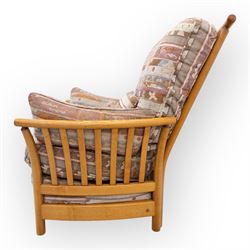 Ercol - Renaissance ash and elm high back armchair, upholstered in geometric Kilim patterned fabric with padded back, seat and arm cushions, curved stick back frame and turned supports